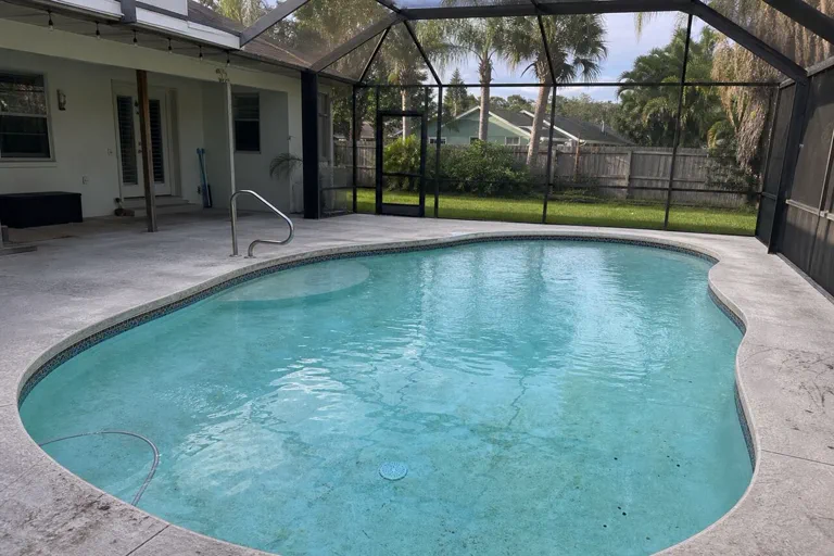 Worn screened lanai pool surface in Brevard County